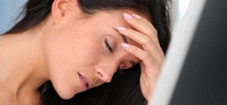 woman-at-computer-with-headache